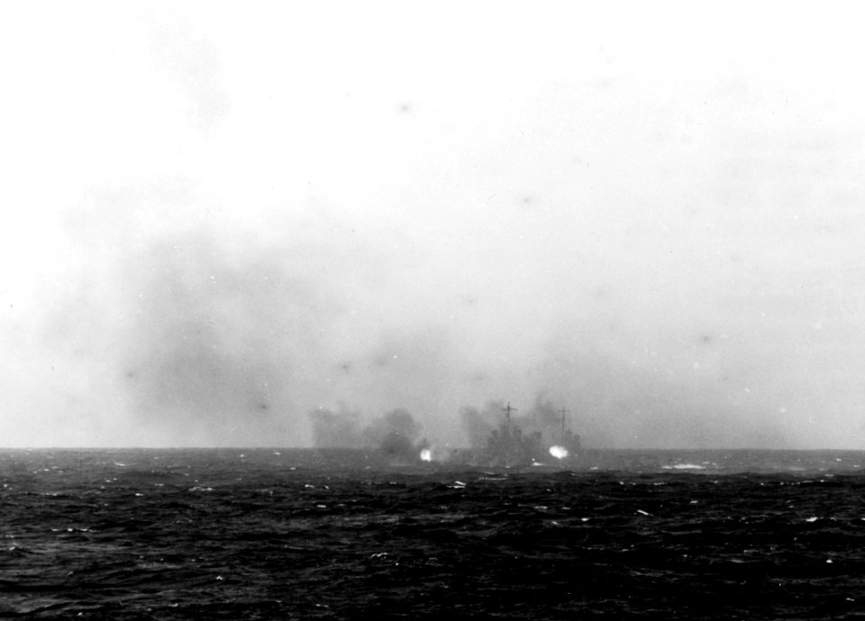 USS Nashville (CL-43) firing at a Japanese picket boat on 18 April 1942 (NH 97500)
