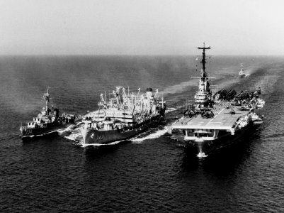 USS Neosho (AO-143) refuels USS Lake Champlain (CVA-39) and USS Purdy (DD-734) in 1955