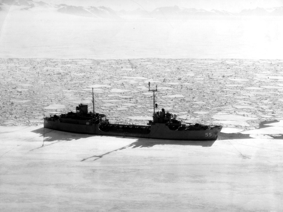 USS Nespelen (AOG-55) moored to ice edge in McMurdo Sound, Antarctica, on 7 January 1956 (USN 800633)