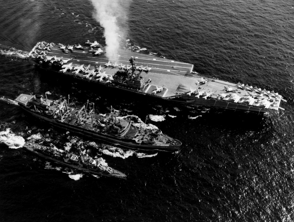 USS Neosho (AO-143) refuels USS Independence (CVA-62) and USS Dyess (DDR-880) in July 1961