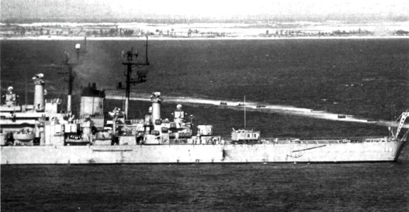 USS Newport News (CA-148) firing on North Vietnamese positions, circa in May 1972 (USN 1151899)