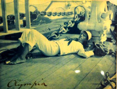 USS Olympia (C-6), U.S. Navy sailor resting on deck circa 1899 (17122788134)