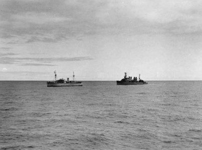 USS Omaha (CL-4) with German blockade runner Odenwald, 6 November 1941 (NH 49935)