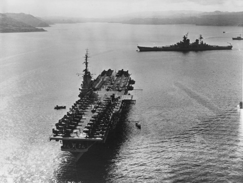 USS Oriskany (CVA-34) and USS Wisconsin (BB-64) at Sasebo in October 1953