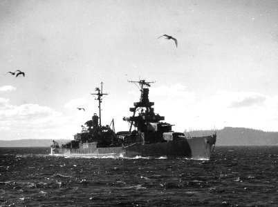 USS Pensacola (CA-24) is towed out of Puget Sound on 9 November 1948 (NH 86700)