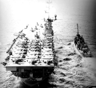 USS Philippine Sea (CVS-47) refuels the destroyer USS Orleck (DD-886) in the Pacific Ocean, in May 1957 (NNAM.1996.488.114.056)