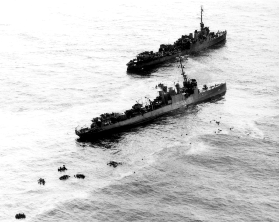 USS Preble (DM-20) stands by the sinking USS Perry (DMS-17) off Angaur on 13 September 1944 (NH 92987)