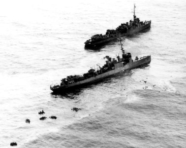 USS Preble (DM-20) stands by the sinking USS Perry (DMS-17) off Angaur on 13 September 1944 (NH 92987)