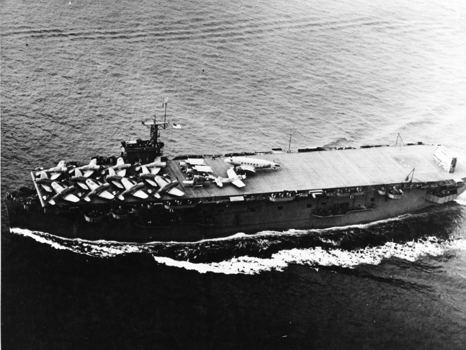 USS Prince William (CVE-31) underway at sea transporting aircraft on 7 August 1943 (NH 106579)