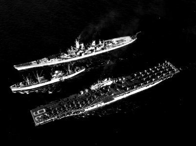 USS Rainier (AE-5) replenishing Antietam (CV-36) and Wisconsin (BB-64) off Korea 1952