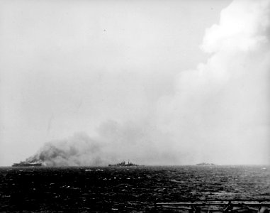 USS Reno (CL-96) and USS Morrison (DD-560) near the burning USS Princeton (CVL-23) in October 1944