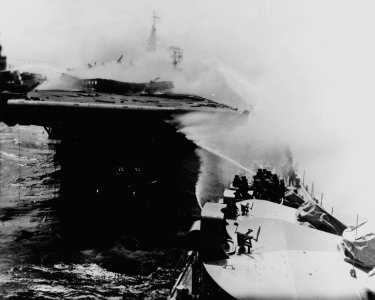USS Reno fighting fires on USS Princeton