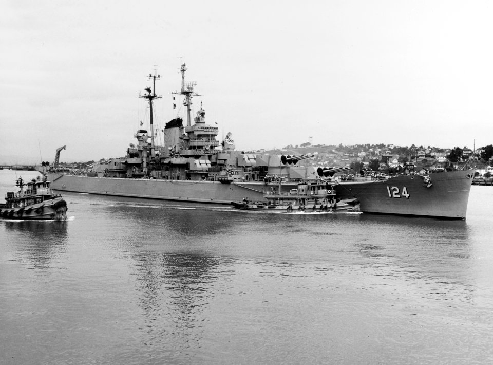 USS Rochester (CA-124) with tugs at the Mare Island Naval Shipyard on 20 September 1953 (NH 84584)