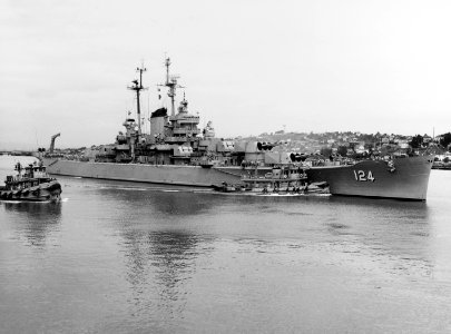 USS Rochester (CA-124) with tugs at the Mare Island Naval Shipyard on 20 September 1953 (NH 84584)