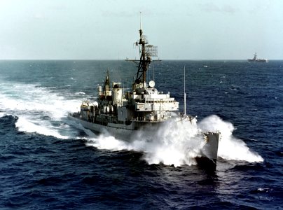 USS Rowan (DD-782) and USS Coral Sea (CVA-43) underway in the Western Pacific, circa in early 1965 (NH 103508-KN)