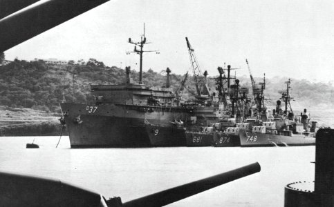 USS Samuel Gompers (AD-37) at anchor with destroyers alongside, circa in 1968