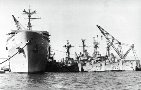 USS Samuel Gompers (AD-37) in port with destroyers alongside, circa in 1968