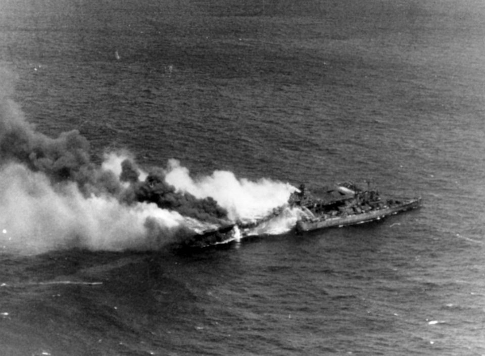 USS Santa Fe (CL-60) fighting fires aboard the burning USS Franklin (CV-13) on 19 March 1945 (80-G-373734)