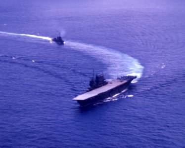 USS Saratoga (CV-3) and a destroyer underway, circa in 1942 (80-G-K-460)