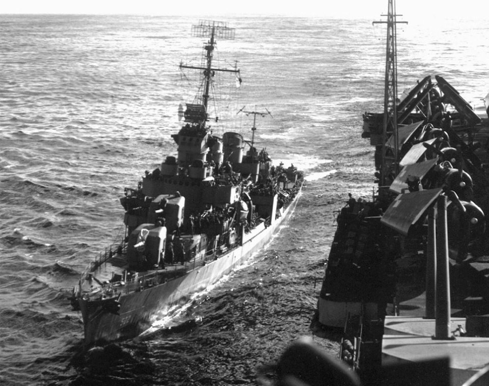 USS Sigsbee (DD-502) alongside of USS Hornet (CV-12), in mid-February 1945 (80-G-317012)