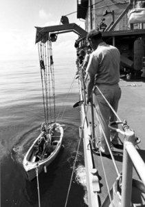 USS Spruance (DD-963) lowers a motor whaleboat, in 1975 (NH 96860)