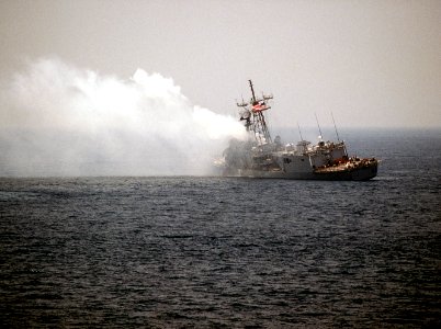 USS Stark (FFG-31) listing after missile hit in the Persian Gulf on 18 May 1987