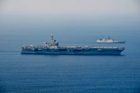 USS Theodore Roosevelt and INS Shivalik transit into formation during a photo exercise as a part of Exercise Malabar 2015