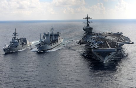USS Theodore Roosevelt and JS Fuyuzuki transit alongside INS Shakti during a replenishment-at-sea exercise