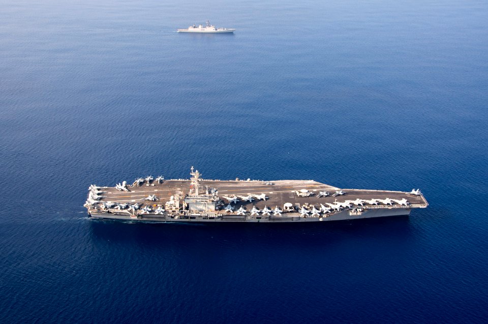USS Theodore Roosevelt and INS Shivalik transit into formation during a photo exercise as a part of Malabar 2015