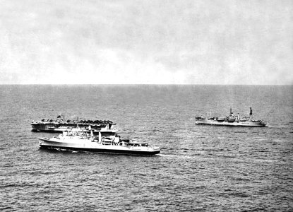 USS Thetis Bay (LPH-6), USS Alamo (LSD-33) and USS Paul Revere (APA-248) underway in the Pacific Ocean, in 1961