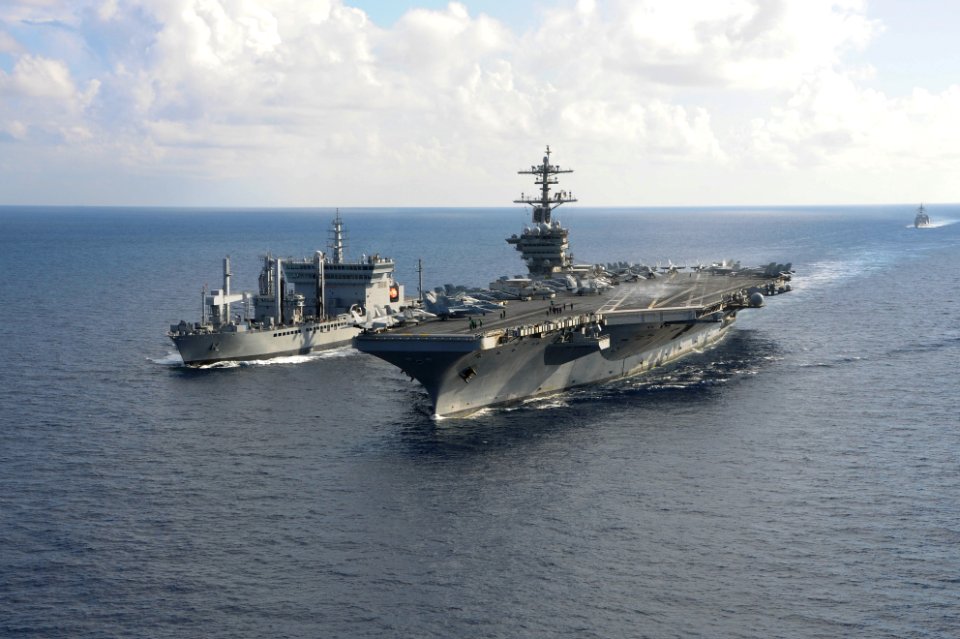 USS Theodore Roosevelt pulls alongside INS Shakti during a replenishment-at-sea exercise as a part of Exercise Malabar 2015
