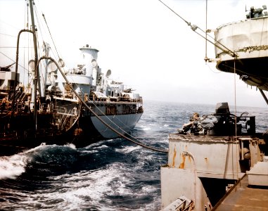 USS Tomahawk (AO-88) refueling McKee (DD-575) in March 1945