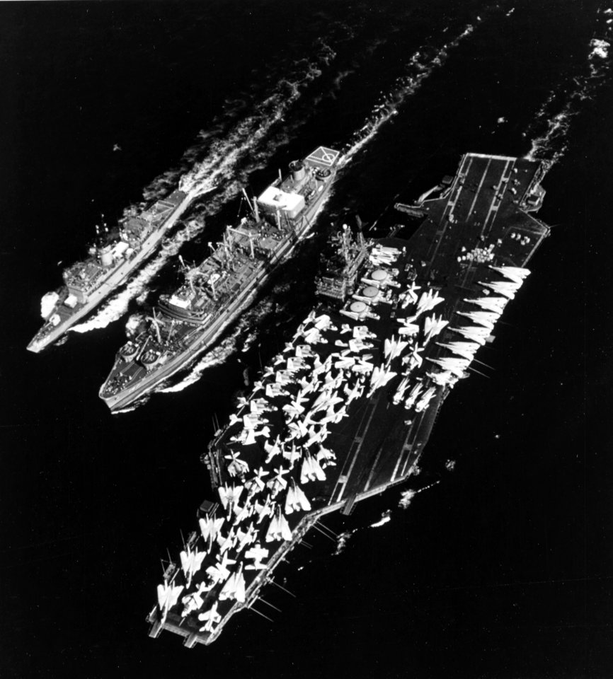 USS Truckee (AO-147) refuels USS John F. Kennedy (CV-67) and USS Thomas C. Hart (FF-1092) in the Mediterranean Sea on 14 August 1975 (K-110070)