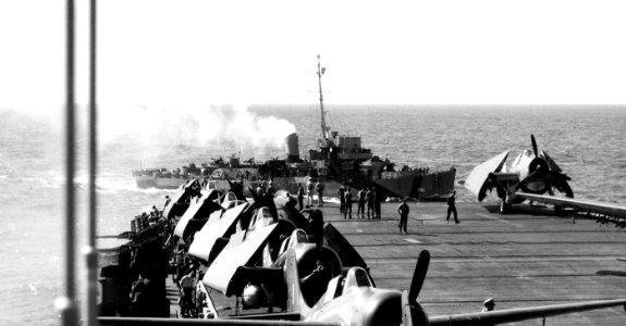 USS Weaver (DE-741) passing aft of USS Sargent Bay (CVE-83) on 6 January 1945 (80-G-263939) photo