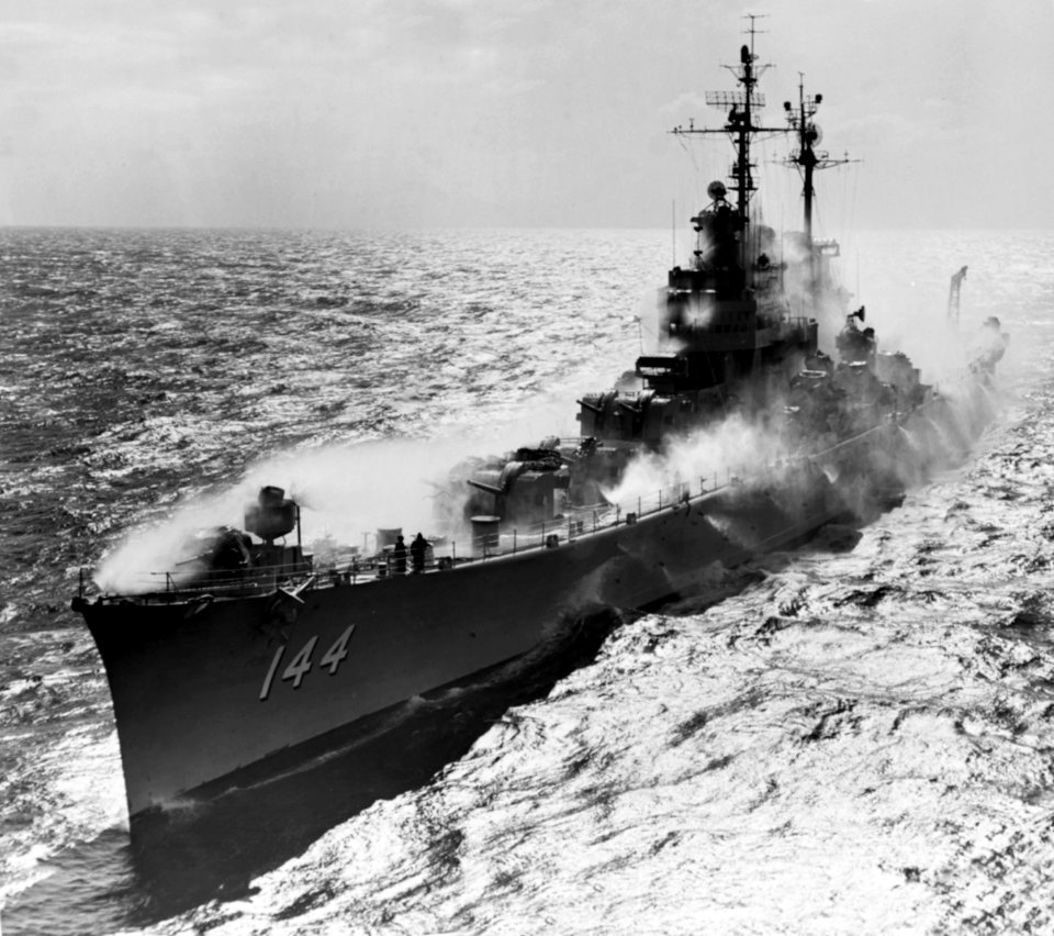 USS Worcester (CL-144) testing her anti-nuclear radiation washdown system on 7 July 1954 (NH 97335)