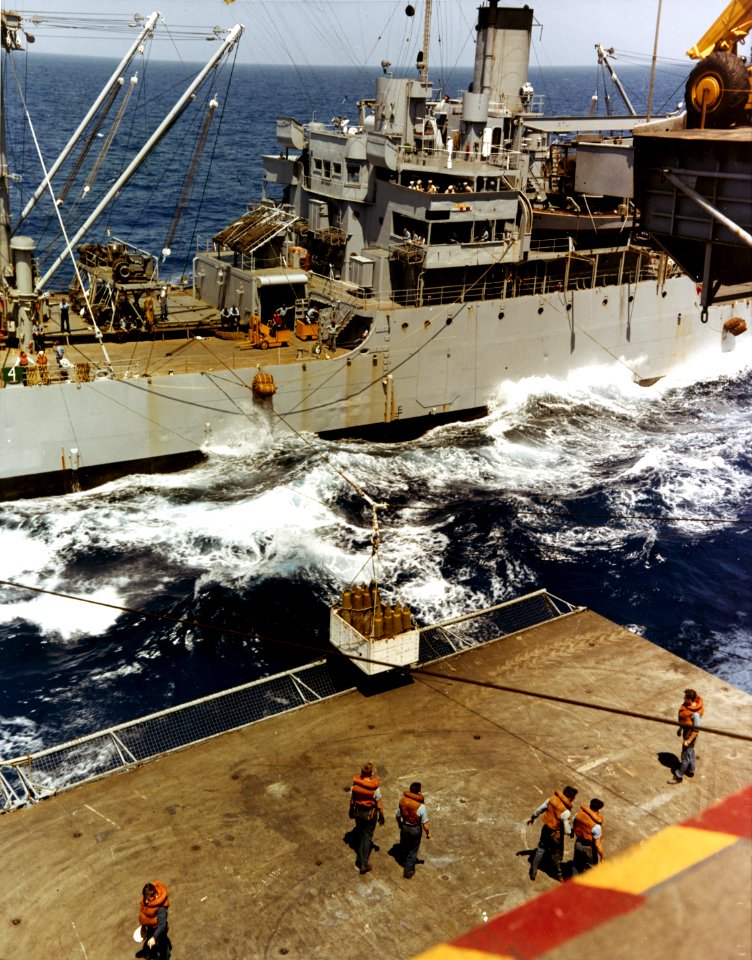 USS Wrangell (AE-12) delivers bombs to USS Saratoga (CVA-60) at sea, 6 June 1958 (KN-369)