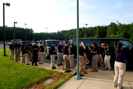 Various law enforcement explorers milling about photo