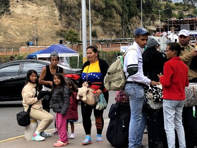 Venezuelans cross the border between Ecuador and Colombia in search of new opportunities