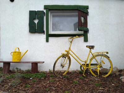 Watering can yellow old house photo