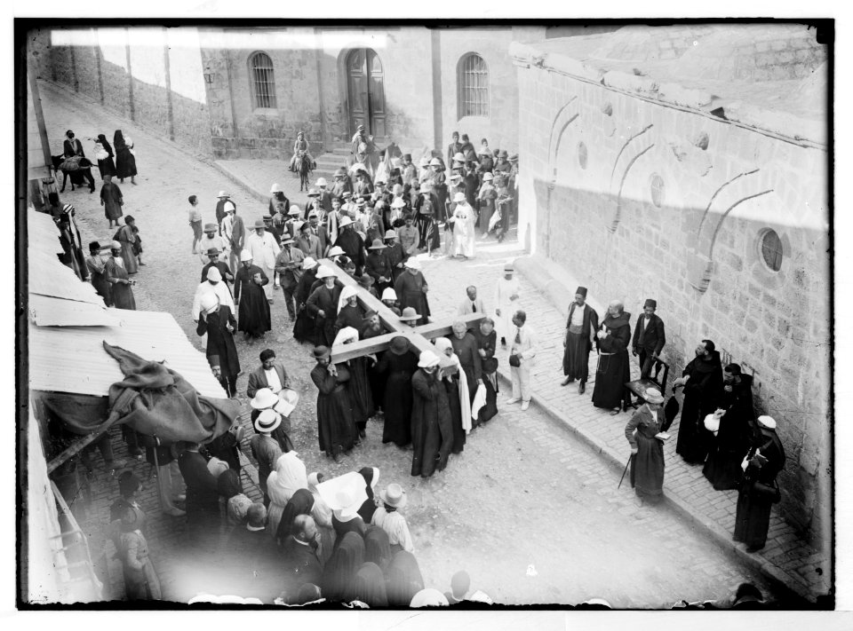 Via Dolorosa, beginning at St. Stephen's Gate. Pilgrims carrying cross on Via Dolorosa. LOC matpc.05443