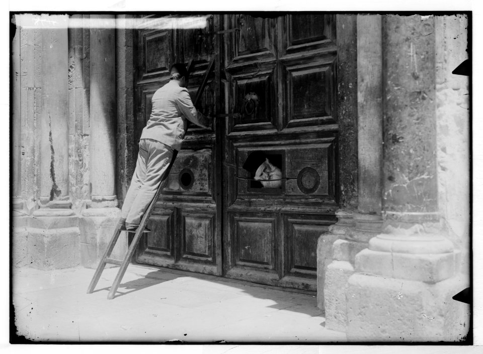 Via Dolorosa, beginning at St. Stephen's Gate. Locking Church of the Holy Sepulchre. LOC matpc.05442