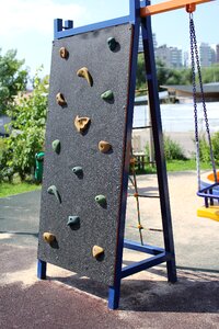 Rock climber climbing for children photo