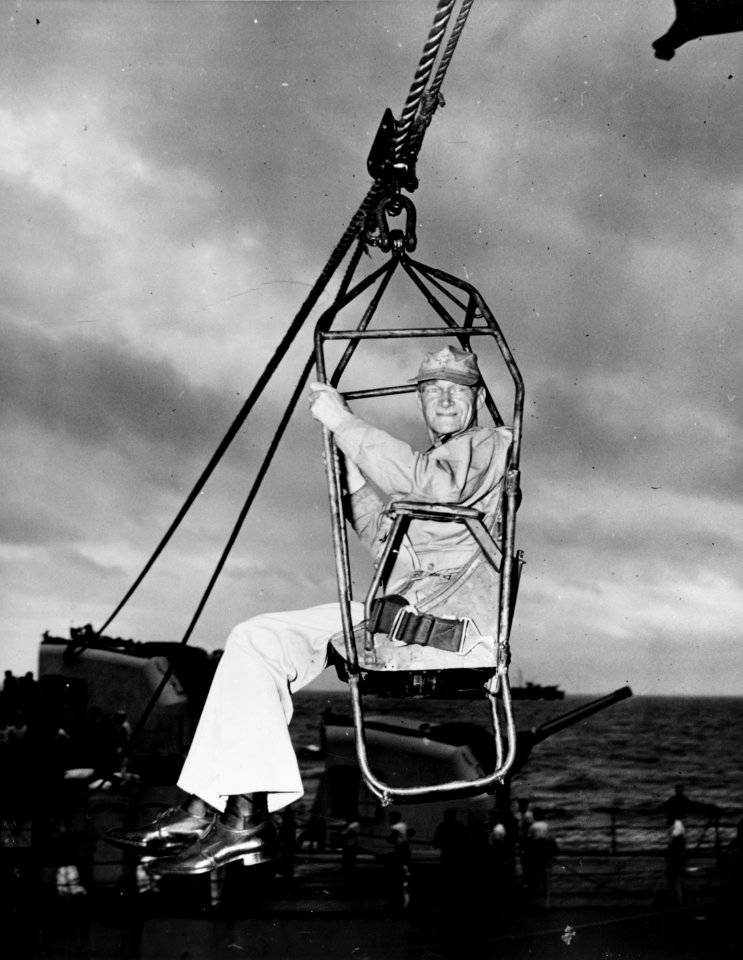 Vice Admiral Marc A. Mitscher is highlined to USS Randolph (CV-15) on 15 May 1945 (80-G-320987)