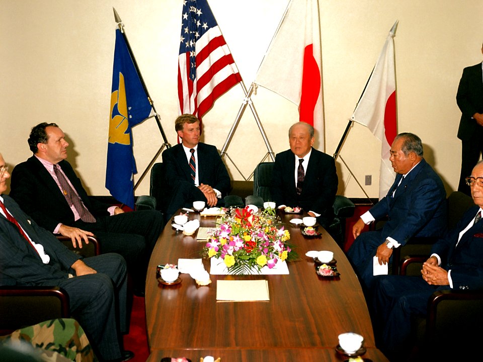 Vice President Dan Quayle, center left, meets with the governor of Okinawa, center right, during his visit to the island