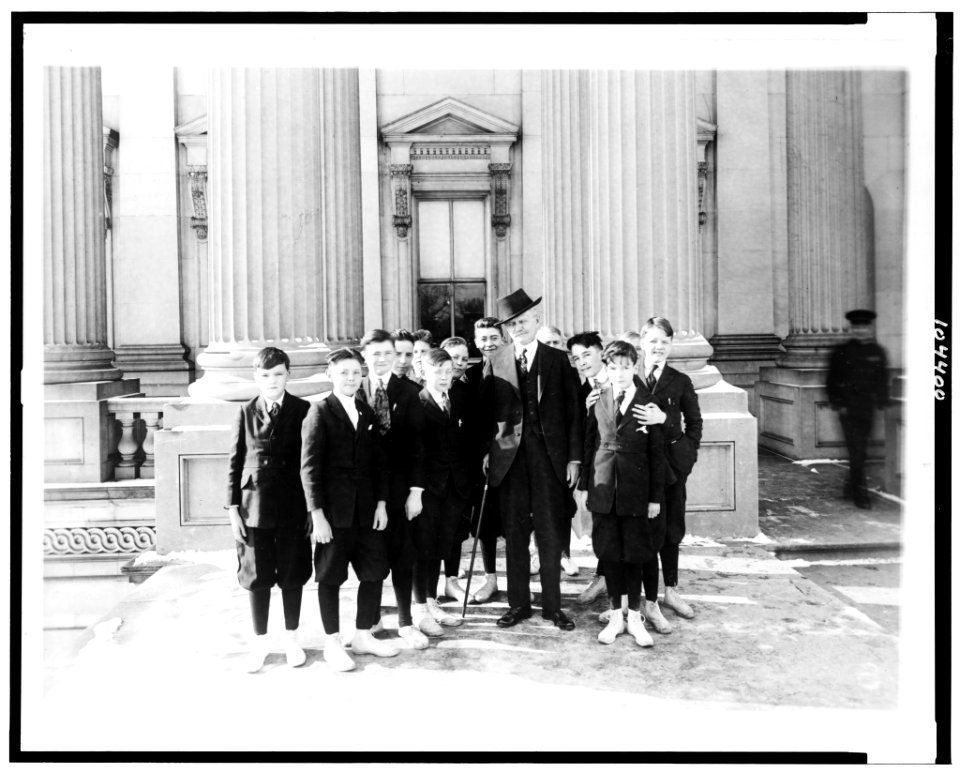 Vice Pres. Marshall will entertain the pages of the Senate at a Christmas party. Photo shows the Vice Pres. and the pages with whom he is very popular on the steps of the Capitol LCCN91793381