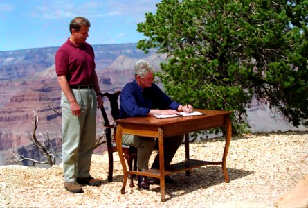Vice President Al Gore stands beside President Bill Clinton as he signs Proclamation 6920
