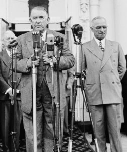 Vice President-elect speaking into microphones on the front porch of the White House. President Harry S. Truman... - NARA - 199949 (cropped)