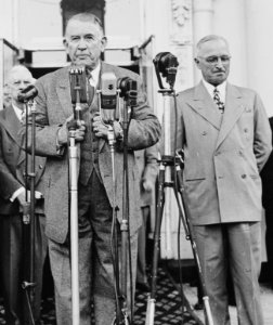 Vice President-elect speaking into microphones on the front porch of the White House. President Harry S. Truman... - NARA - 199949 (cropped) photo