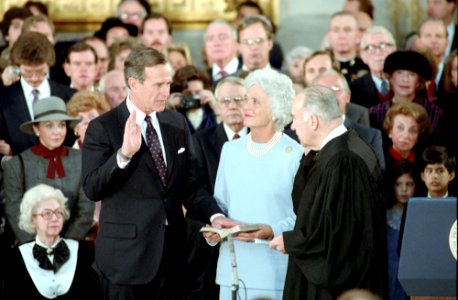 Vice President George H. W. Bush Taking His Oath of Office with Justice Potter Stewart with Barbara Bush Looking on in The Us Capitol