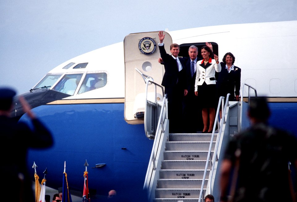 Vice President J. Danforth Quayle and Marilyn Quayle wave to the crowd upon their arrival on base